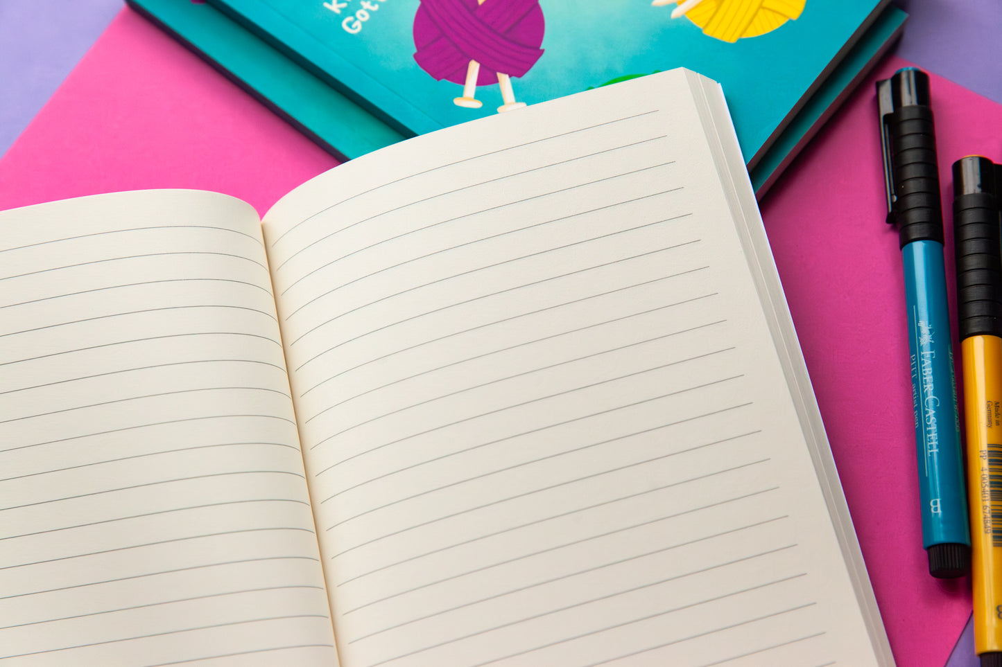 The interior of a notebook showing the cream coloured lined paper